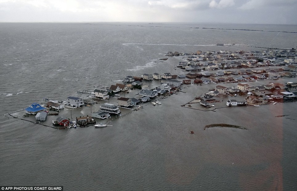 Underwater: This picture provided shows flooded homes in Tuckerton, New Jersey, after Superstorm Sandy made landfall on the southern New Jersey coastline